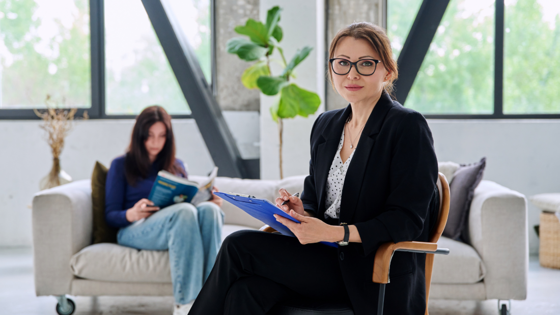 Professional hiring manager interviewing job candidate in modern office